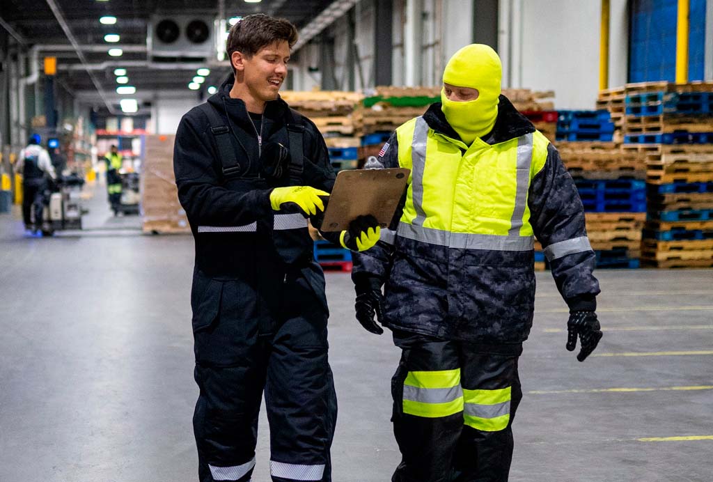 Professionals wearing work clothes in a logistics unit